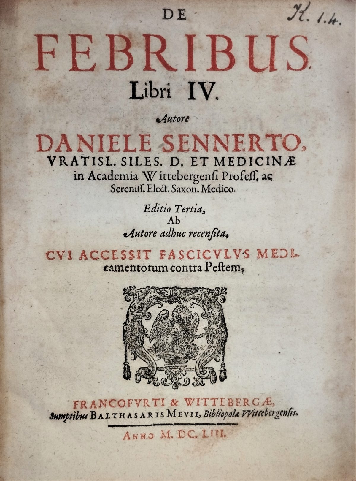 The title page in a 17th-century printed book, with a Latin text printed in red and black and a woodcut printer's device of a pelican feeding its young with blood from its breast.