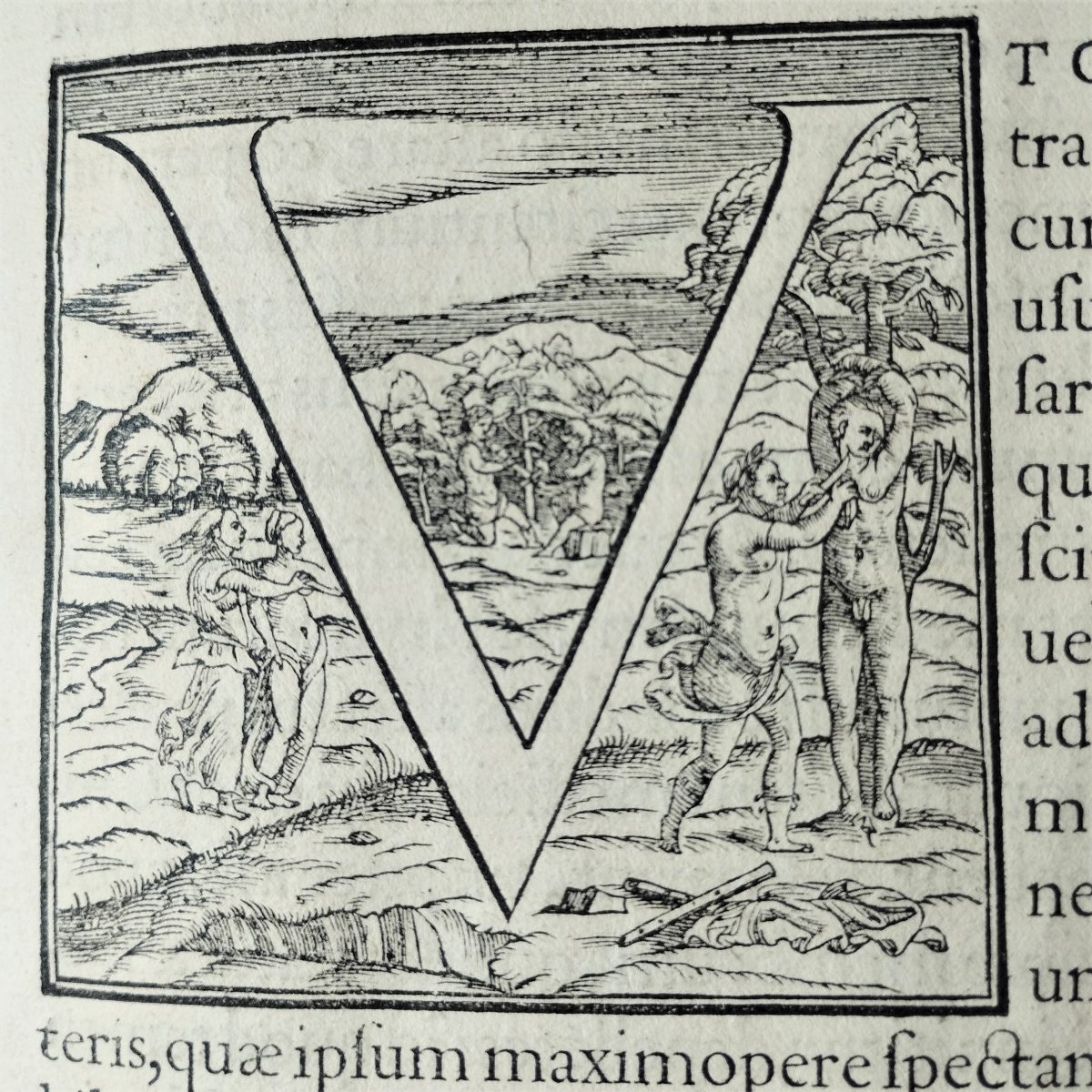 Decorated initial, letter V. On the right one man is cutting the throat of another man tied to a tree, on the left two women watch and point at them, at the far back two men are playing the flute. 