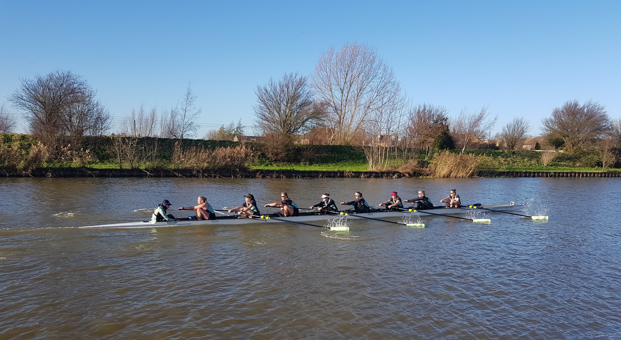 The Cambridge women's Blue boat on the water preparing for the Boat Race