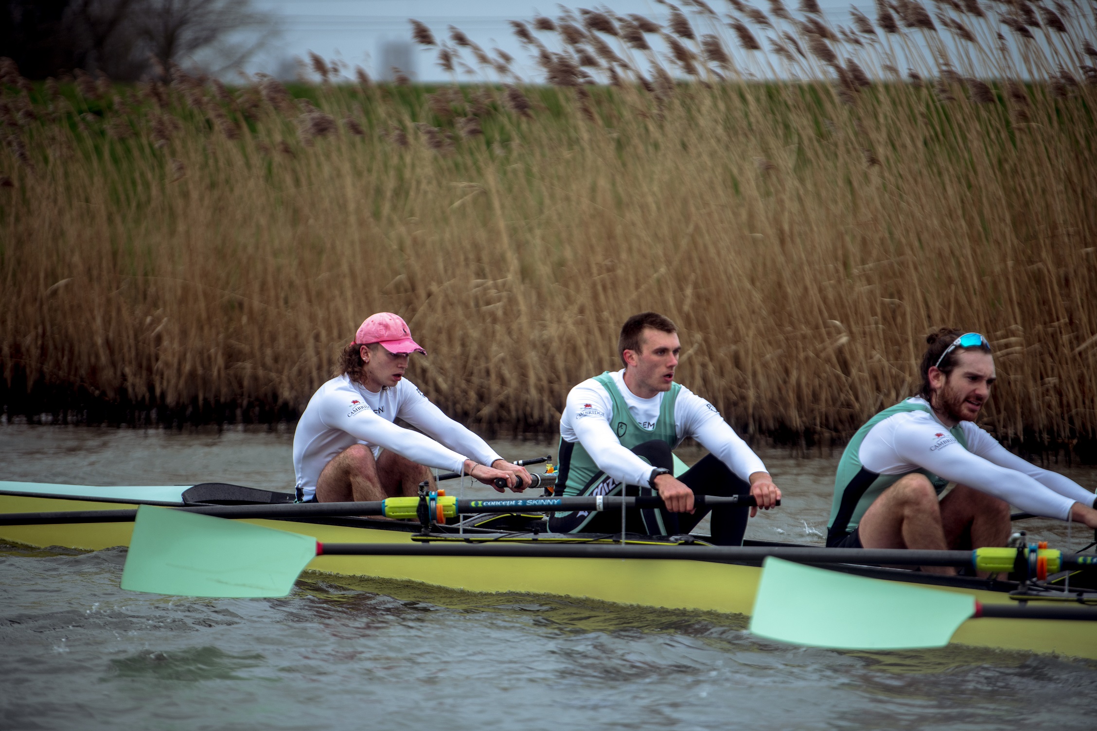 Three rowers, with Ben Dyer in the middle, on the river