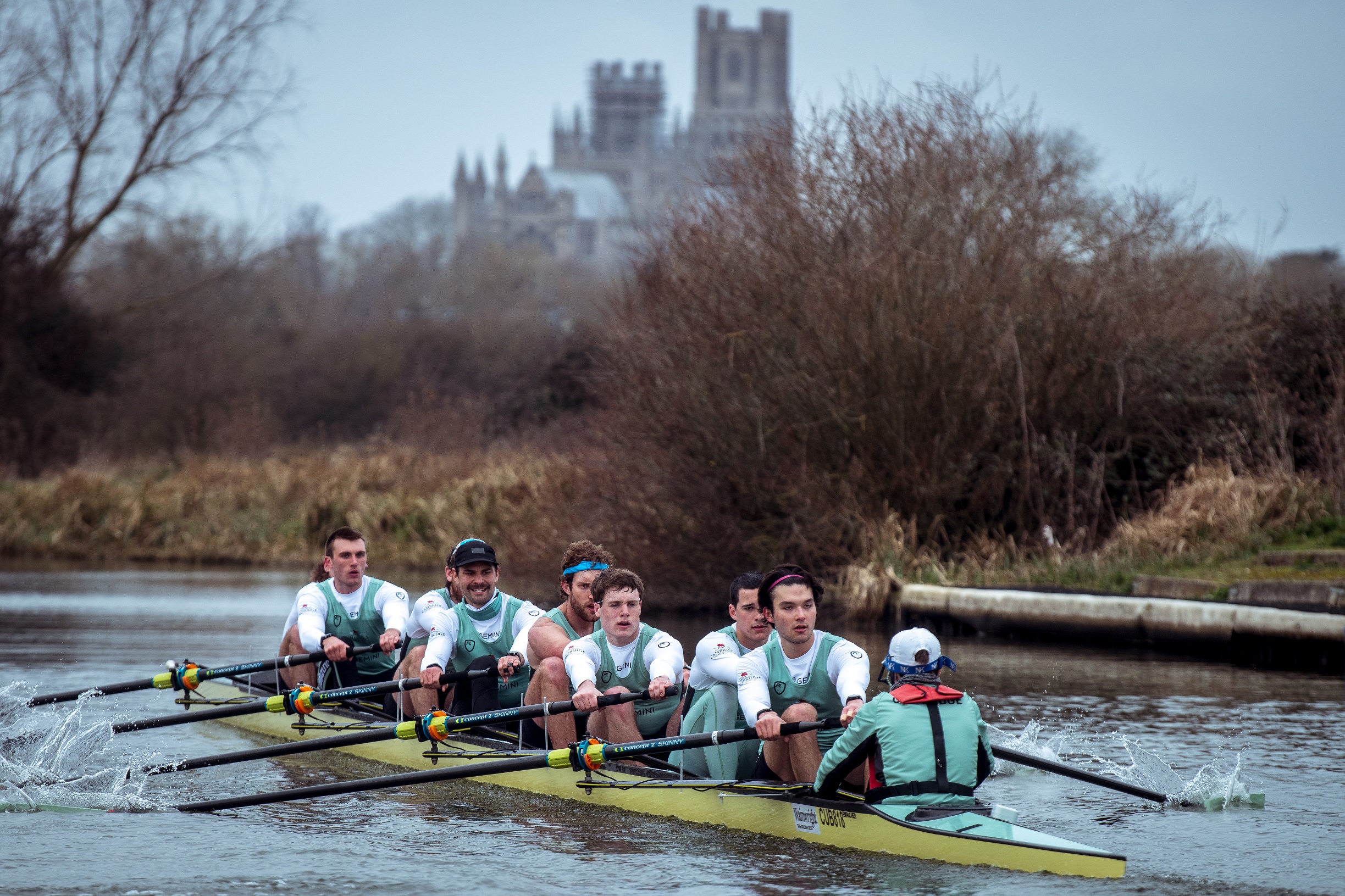 Ben Dyer pictured left in the Cambridge Blue boat, with Ely Cathedral in the background