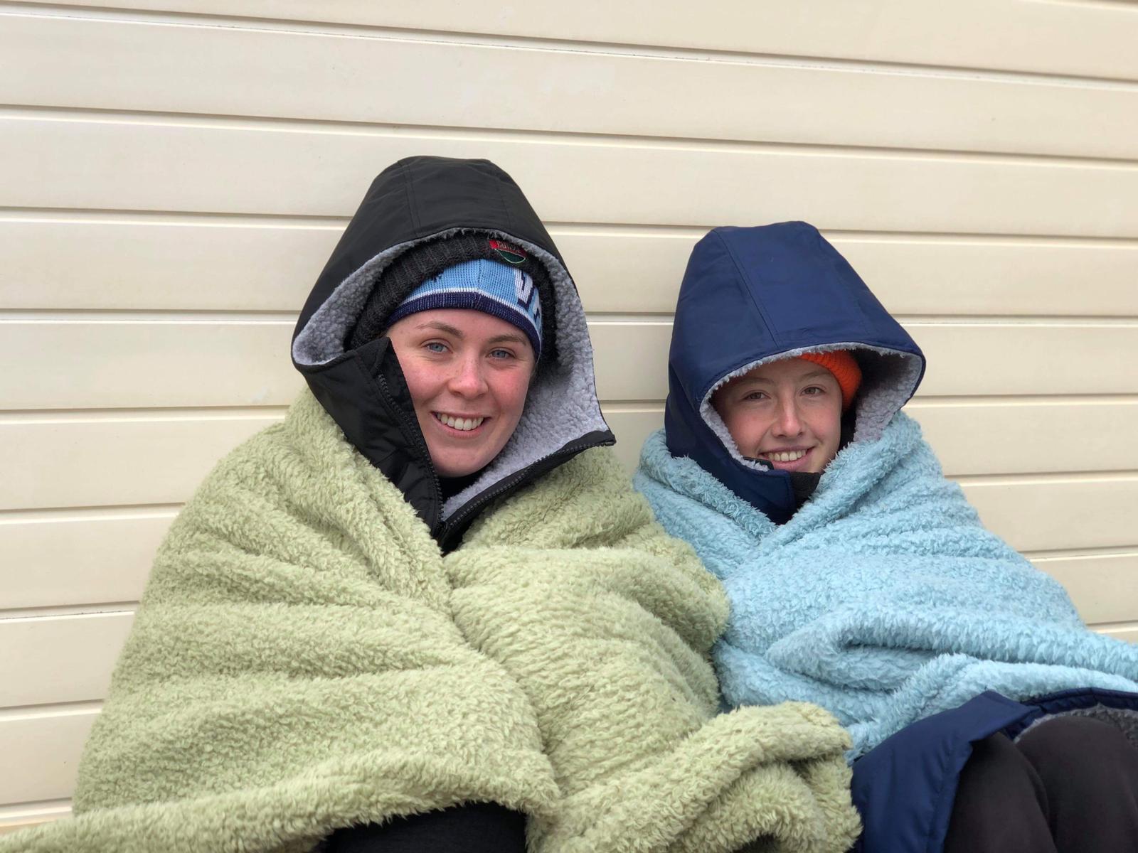 Charlotte Rowlands and Ella Honey wrapped up warm following a swim