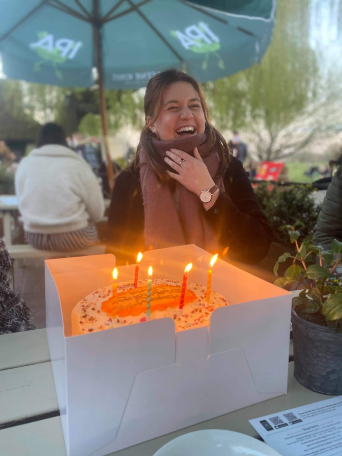 Liana Hardy with a candle-lit birthday cake