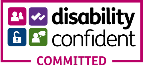 A badge reading disability confident committed