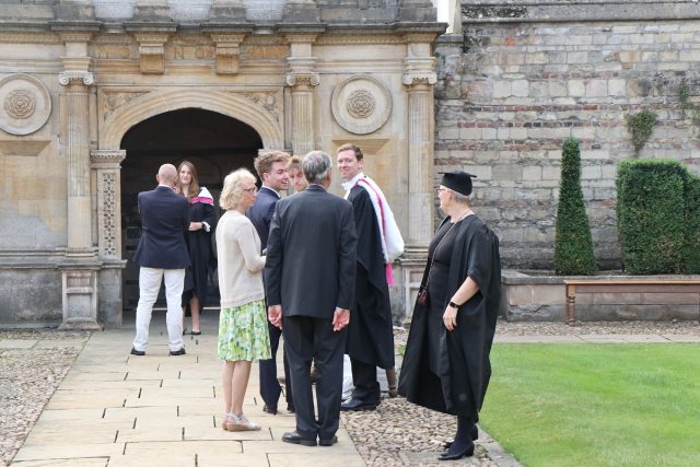 Graduates with friends and family in front of the Gate of Honour